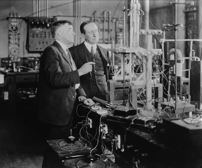 Framed Print : Irving Langmuir (1881-1957) with Guglielmo Marconi (1874-1937), Nobel Prize winners, possibly in Langmuir's General Electric Chemistry laboratory