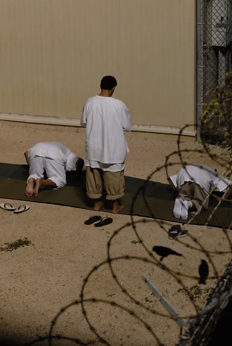 Framed Print : Islamic detainees pray at Camp Delta the military prison at Naval Station Guantanamo Bay Cuba. Oct. 28 2009. Photo by:Everett Collection(BSLOC_2011_6_162)