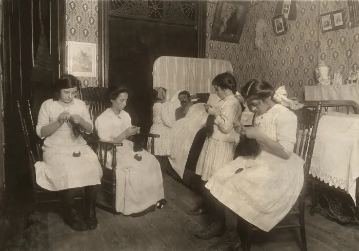 Framed Print : Italian-American family doing homework in their apartment, with the father sick in bed. The mother, two teenagers, and one girl are crocheting bags in NYC, in Nov. 1912 Framed Print : Italian-American family doing homework in their apartment, with the father sick in bed. The mother, two teenagers, and one girl are crocheting bags in NYC, in Nov. 1912