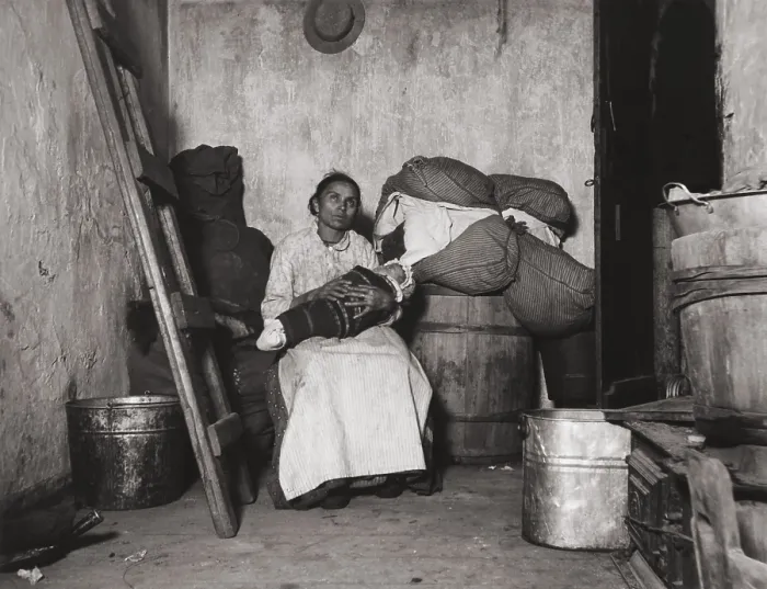 Framed Print : Italian immigrant rag-picker sits with her baby in a small run-down tenement room. Collecting salvage items to sell was work adopted by many poor urban immigrants Framed Print : Italian immigrant rag-picker sits with her baby in a small run-down tenement room. Collecting salvage items to sell was work adopted by many poor urban immigrants