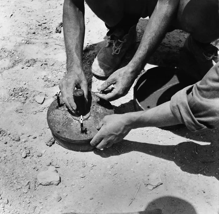 Framed Print : Two Italian soldiers disarming a land mine in the Axis occupied zone of Egypt. 1942. World War 2. (BSLOC_2014_10_160) Framed Print : Two Italian soldiers disarming a land mine in the Axis occupied zone of Egypt. 1942. World War 2. (BSLOC_2014_10_160)