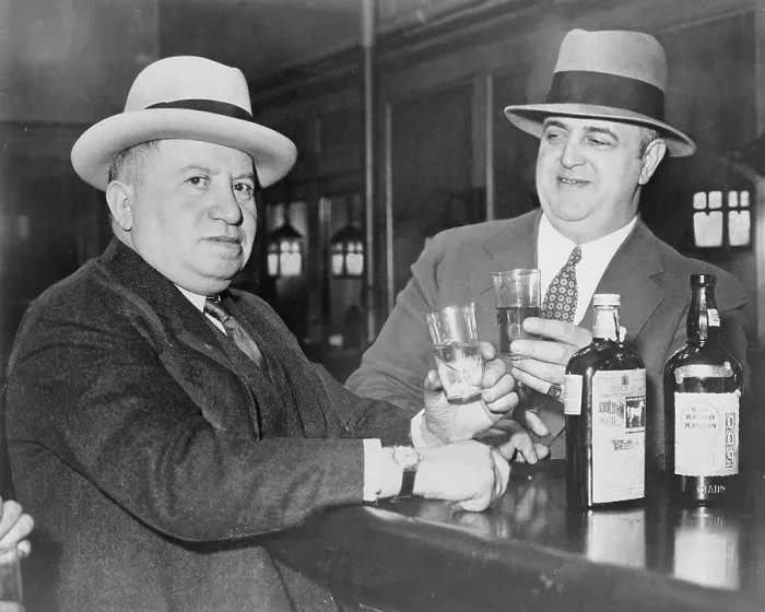 Framed Print : Izzy Einstein (left) sharing a toast with his partner, Moe Smith in a New York bar in 1935