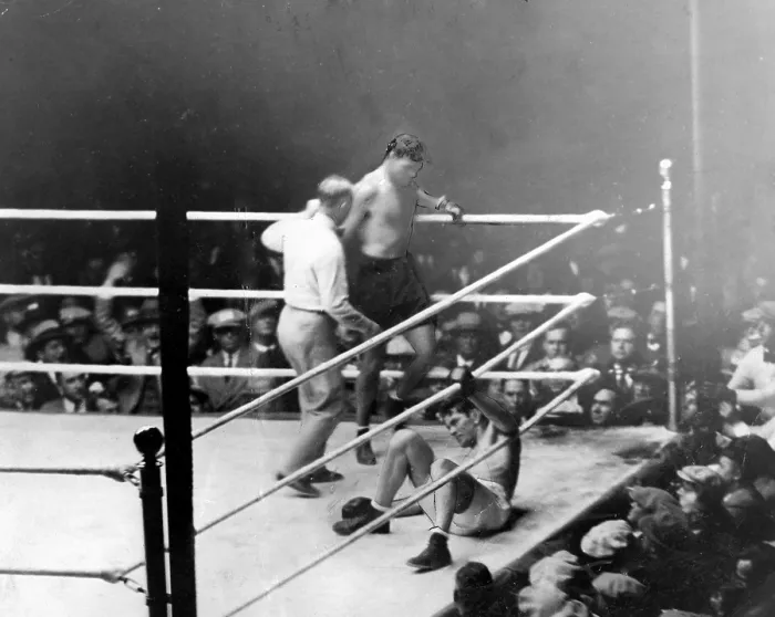 Framed Print : Jack Dempsey knocks down Gene Tunney in 7th round of Controversial fight. After miscount by referee, Tunney recovers and beats Dempsey, retaining his title by unanimous decision