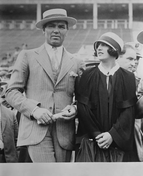Framed Print : Jack Dempsey and wife, actress Estelle Taylor, at a sports event. They co-starred in a Broadway play called THE BIG FIGHT 1928. (BSLOC_2015_17_75)
