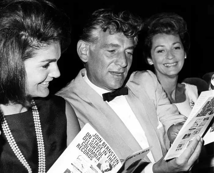 Framed Print : Jacqueline Kennedy, Leonard Bernstein and Felicia Montealegre look at their programs during a performance of Leonard Bernstein's Theatre Songs, 1965