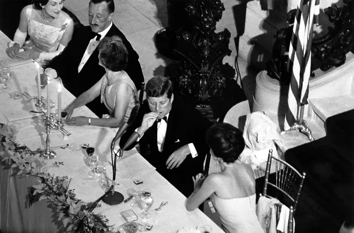 Framed Print : Jacqueline Kennedy leans over to talk with President Kennedy at the America's Cup Dinner Framed Print : Jacqueline Kennedy leans over to talk with President Kennedy at the America's Cup Dinner