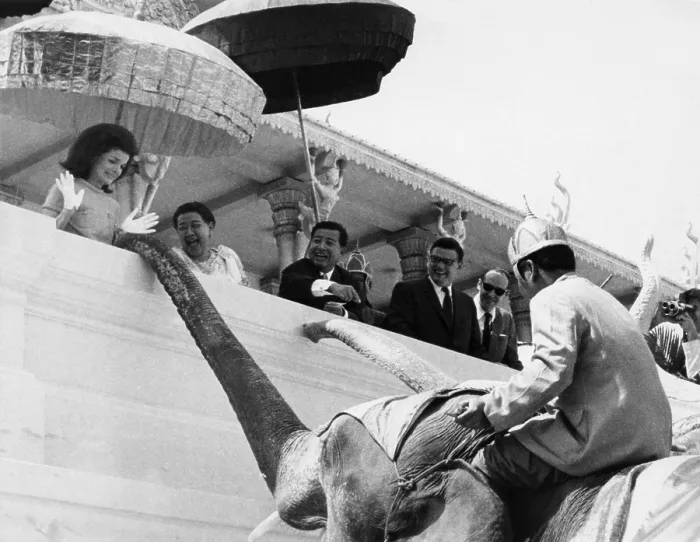 Framed Print : Jacqueline Kennedy (left) jumps in amazement as a royal elephant extends his trunk