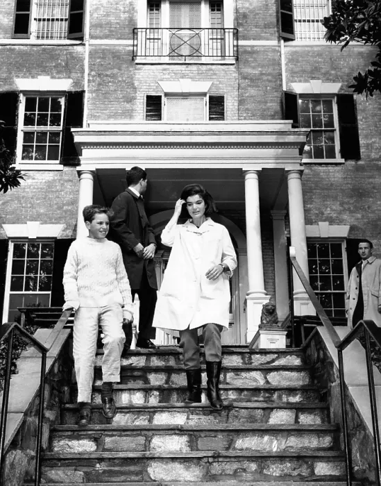 Framed Print : Jacqueline Kennedy, moving into her Federal Period Georgetown home. At her side is Joe Kennedy, son of Attorney General Robert and Ethel Kennedy. Person at center is unidentified