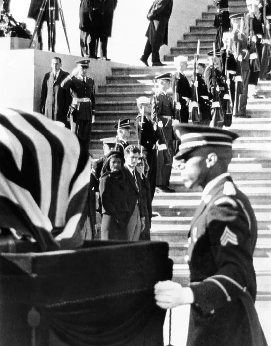 Framed Print : Jacqueline Kennedy, in a widow's veil, watches as coffin containing the body President John Kennedy, is placed on caisson Framed Print : Jacqueline Kennedy, in a widow's veil, watches as coffin containing the body President John Kennedy, is placed on caisson