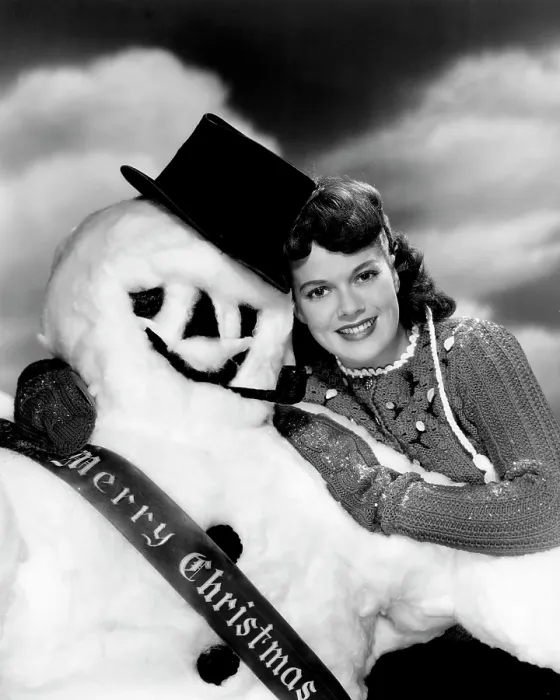 Framed Print : Janis Paige offering Christmas greetings, Warner Bros. portrait by Eugene Robert Richee, late 1940s