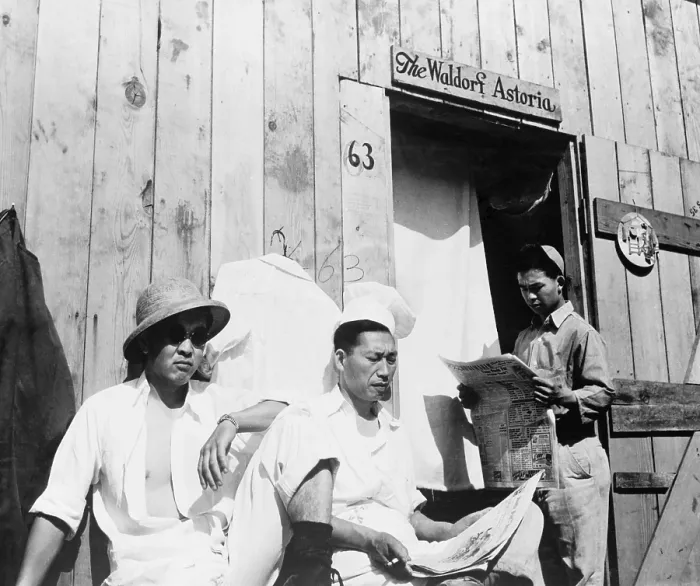 Framed Print : Japanese American men from Seattle, Washington sit outside a barracks during their four month stay at Puyallup Assembly Center in 1942 Framed Print : Japanese American men from Seattle, Washington sit outside a barracks during their four month stay at Puyallup Assembly Center in 1942