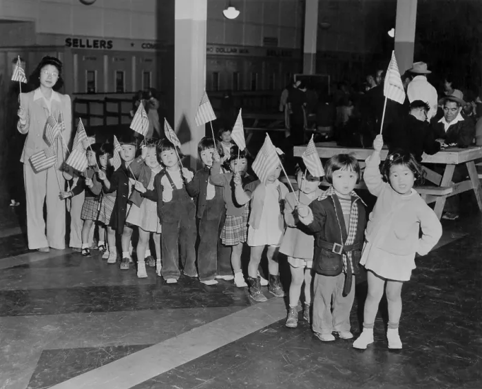 Framed Print : Japanese-American youngsters carry flags in Americanization program at the Santa Anita Assembly Center
