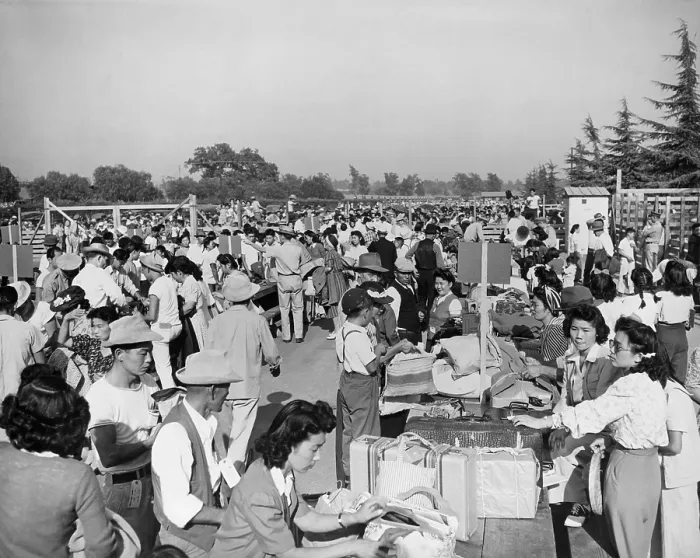 Framed Print : Japanese-Americans at the Santa Anita Assembly Center where family groups identify their baggage prior to departure to the relocation camps that would be their homes for