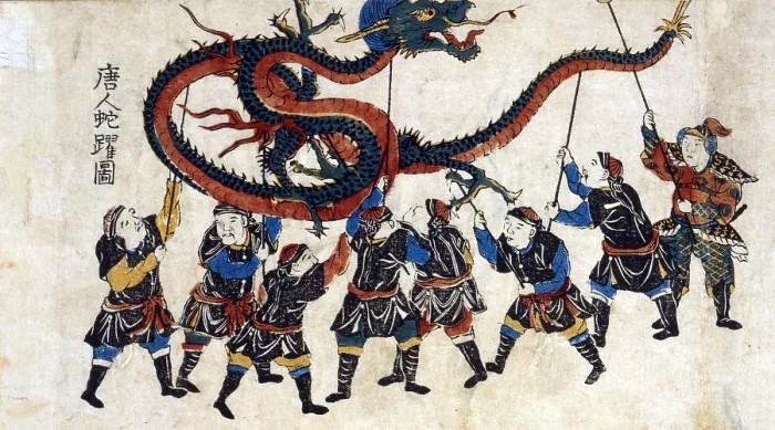 Framed Print : Japanese print shows eight Chinese men holding up a dragon with sticks for the dragon dance. Ca. 1875