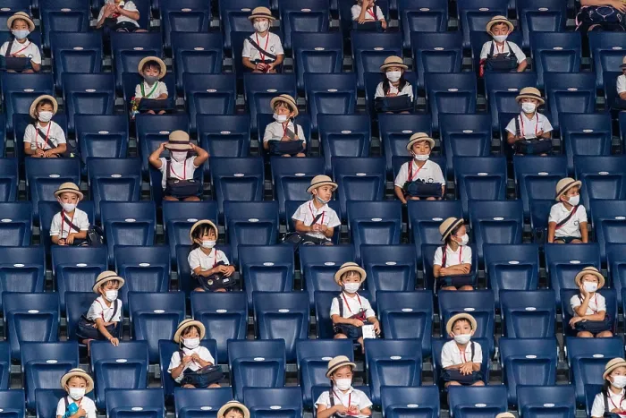 Framed Print : Japanese school children in stadium seats are socially distanced during the Covid-19 pandemic, Aug. 25, 2021