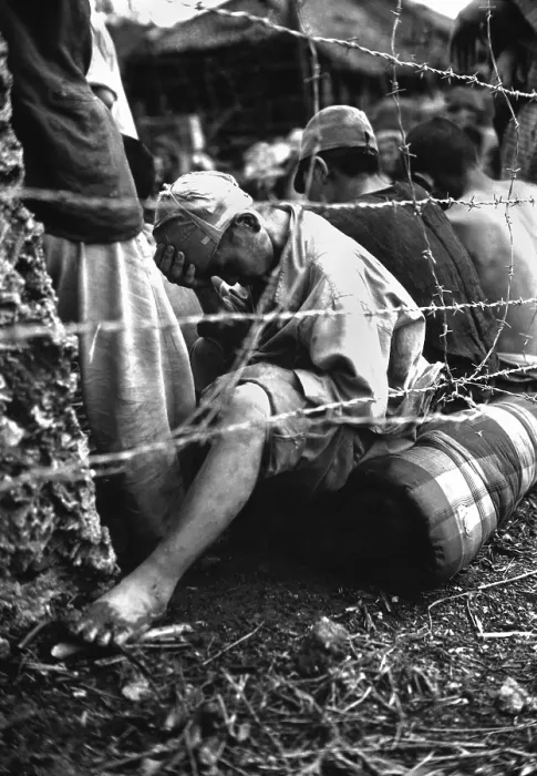 Framed Print : Japanese soldier sits dejectedly in a prisoner of war enclosure on Okinawa. June 1945, during World War 2. (BSLOC_2013_14_277)