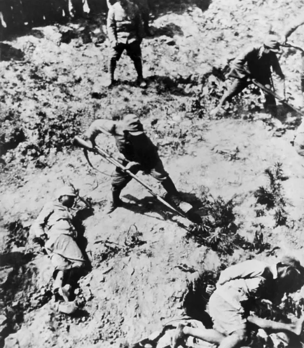 Framed Print : Japanese soldiers with bayonets menacing their Chinese captives. The victims lie on the ground with their hands bound. Between 1937 -1943. (BSLOC_2013_9_119)