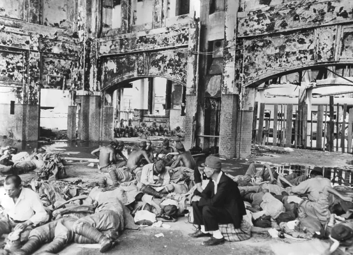 Framed Print : Japanese troops resting in railway station after Hiroshima explosion