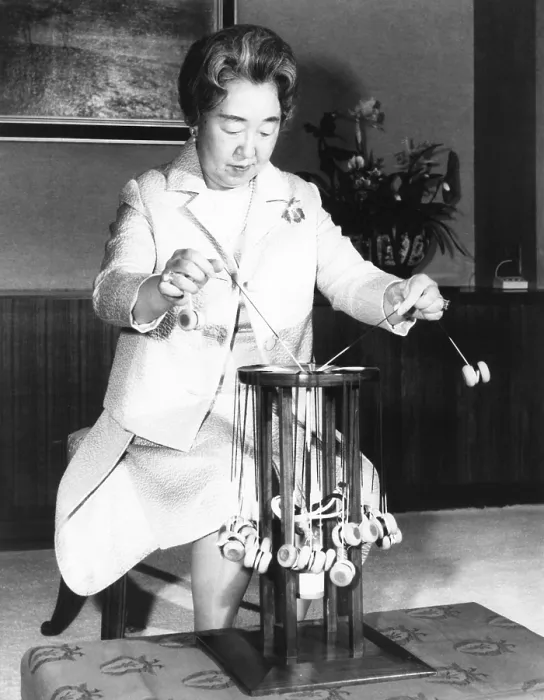 Framed Print : Japan's Empress Nagoto, weaving on a manual braiding machine at the Imperial Palace. March 17, 1971. The braids were used as sashes for kimonos worn by the Imperial family