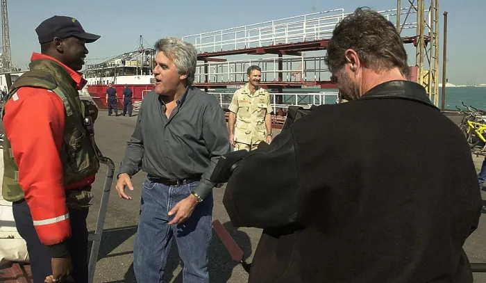 Framed Print : Jay Leno greets sailors at an undisclosed location during the first months of US operations in Afghanistan after the al Qaeda's 9 / 11 attacks on the US. Dec. 23 2001
