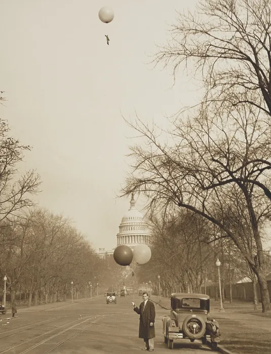 Framed Print : J.E. Woods, of the U.S. Army Signal Corps, about to release a second balloon, Jan. 1931. He was protesting the location of the new Army & Navy Building. U.S