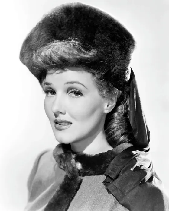 Framed Print : Jean Parker, modeling a beaver hat with brown silk jersey drapery, 1941