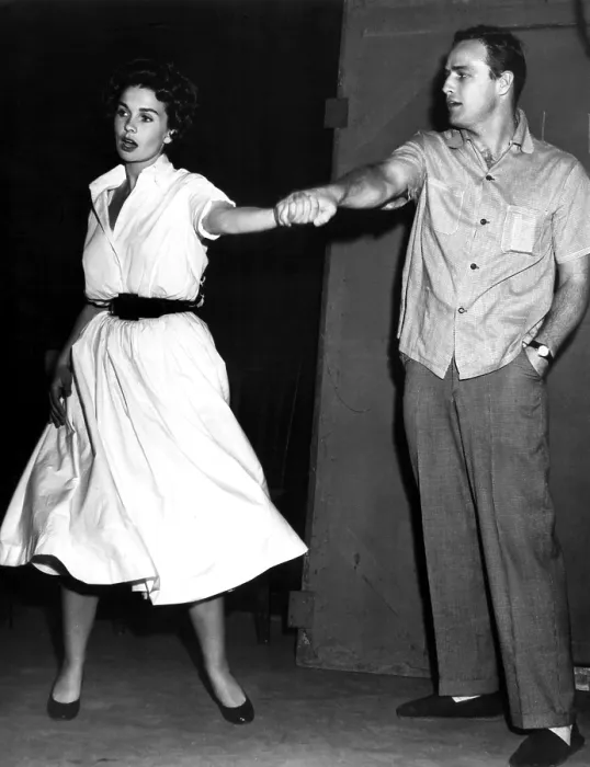 Framed Print : JEAN SIMMONS and MARLON BRANDO run through a rendition of 'If I Were a Bell' during production of GUYS AND DOLLS, 1955