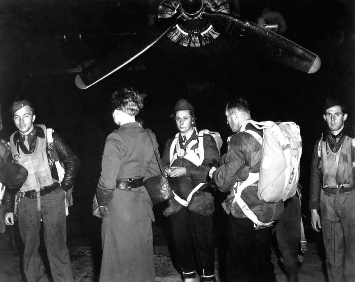 Framed Print : A Jedburgh team by a B-24 from which they would parachute into occupied France