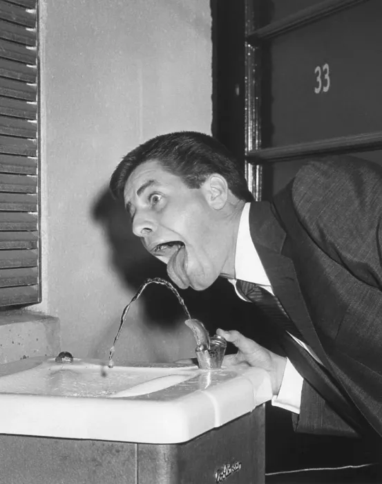 Framed Print : Jerry Lewis providing White House Photographer, Abbie Rowe, with a comic image at water fountain. July 25, 1957. - (BSLOC_2014_16_167) Framed Print : Jerry Lewis providing White House Photographer, Abbie Rowe, with a comic image at water fountain. July 25, 1957. - (BSLOC_2014_16_167)