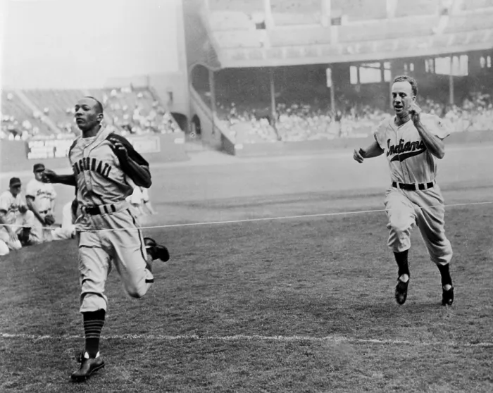 Framed Print : Jesse Owens beating baseball player George Case in 100-yard dash at Cleveland Stadium. Cash was baseball's faster player, and Jesse was the 1936 Olympic running champion. 1946