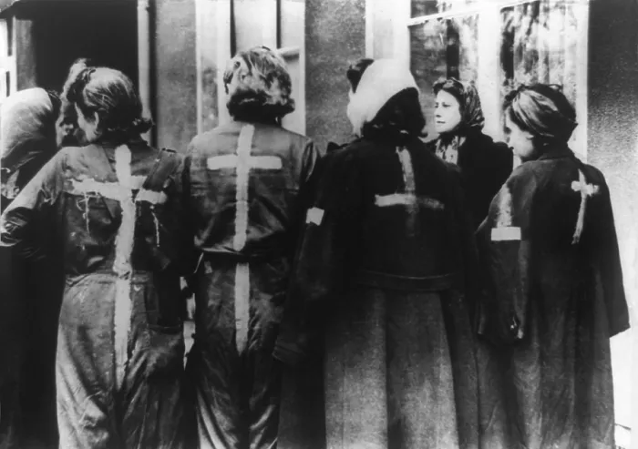 Framed Print : Four Jewish girls, with yellow crosses painted on backs of their clothing by Nazis. The young women were liberated by U.S. 9th Army from an ammunition factory in Kaunitz, Germany Framed Print : Four Jewish girls, with yellow crosses painted on backs of their clothing by Nazis. The young women were liberated by U.S. 9th Army from an ammunition factory in Kaunitz, Germany