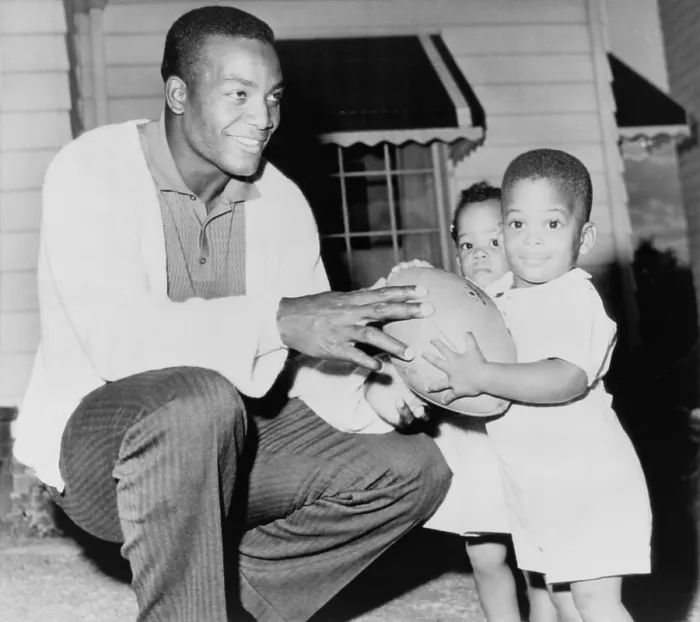 Framed Print : Jim Brown, at the beginning of his professional football career with his twins, Kevin and Kim. Sept. 27, 1961