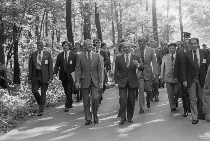 Framed Print : Jimmy Carter Menahem Begin and Israeli delegation stroll within Camp David. The delegation was critical to the success of the summit negotiations. Sept 5-17 1978 Framed Print : Jimmy Carter Menahem Begin and Israeli delegation stroll within Camp David. The delegation was critical to the success of the summit negotiations. Sept 5-17 1978