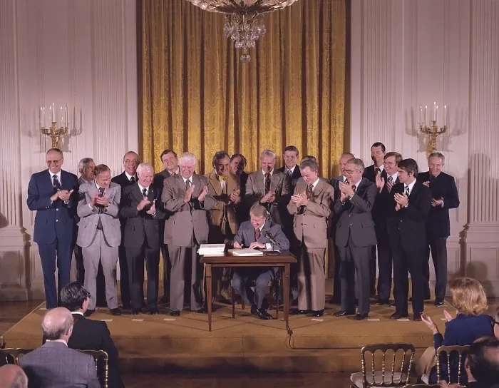 Framed Print : Jimmy Carter signs the National Energy Act which promoted fuel efficiency and renewable energy through taxes and tax credits. Secretary of Energy James Schlesinger b
