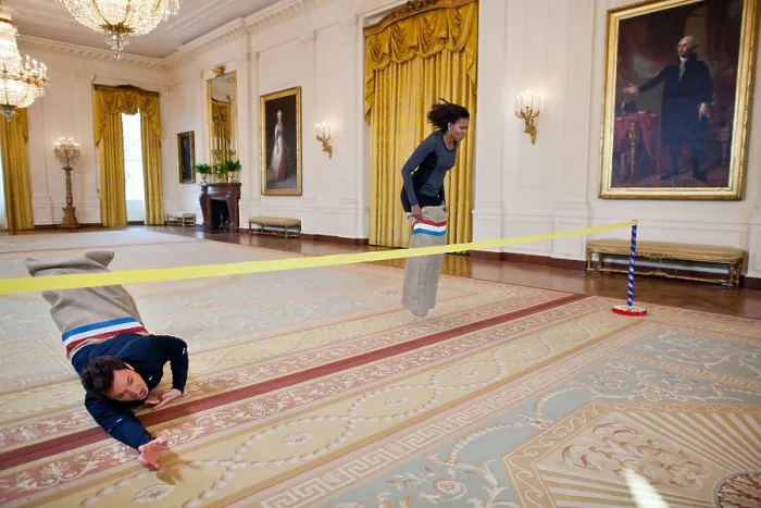 Framed Print : Jimmy Fallon and First Lady Michelle Obama have a potato sack race in the East Room. They were taping for Late Night with Jimmy Fallon on Jan Framed Print : Jimmy Fallon and First Lady Michelle Obama have a potato sack race in the East Room. They were taping for Late Night with Jimmy Fallon on Jan
