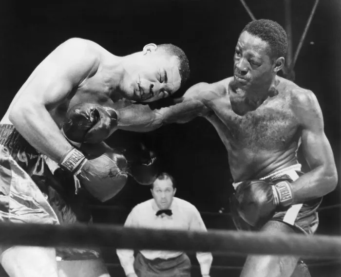 Framed Print : Joe Louis (left), takes a hard right punch in the midsection from Ezzard Charles, in a heavyweight title bout, at New York's Yankee Stadium. Charles won the fight on points Framed Print : Joe Louis (left), takes a hard right punch in the midsection from Ezzard Charles, in a heavyweight title bout, at New York's Yankee Stadium. Charles won the fight on points
