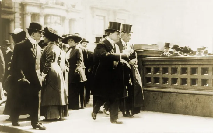 Framed Print : John Davison Rockefeller (1839-1937), walking with his son John D. Jr. in New York as onlookers watch the pair. Ca. 1910