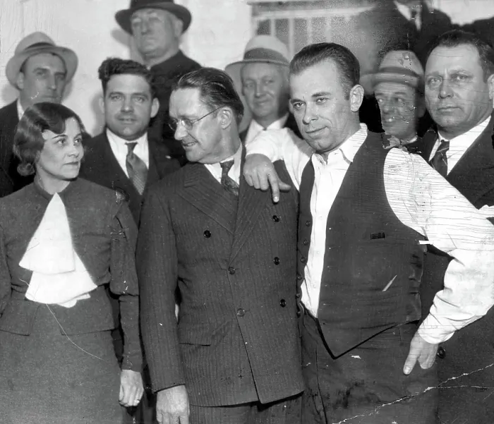 Framed Print : JOHN DILLINGER-Dillinger with Prosecuting Attorney, Robert Estill and Sheriff Lillian Holley, his jailer, at the jail in Crown Point, IN. 1-30-34 Framed Print : JOHN DILLINGER-Dillinger with Prosecuting Attorney, Robert Estill and Sheriff Lillian Holley, his jailer, at the jail in Crown Point, IN. 1-30-34