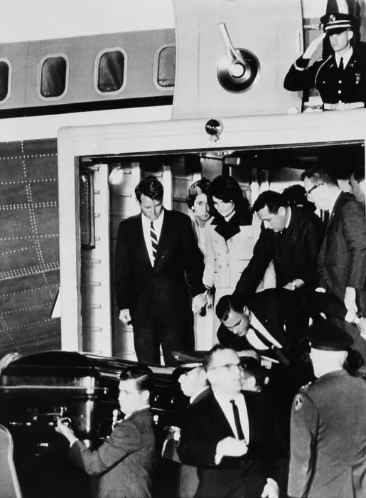 Framed Print : John Kennedy's Coffin. Robert Kennedy holds Jacqueline Kennedy's hand as they watch the body of the assassinated President removed from Air Force One to an ambulance Framed Print : John Kennedy's Coffin. Robert Kennedy holds Jacqueline Kennedy's hand as they watch the body of the assassinated President removed from Air Force One to an ambulance
