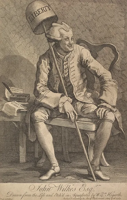 Framed Print : John Wilkes, is depicted with a demonic-looking wig, crossed eyes, and holding a Liberty Bell in a 1763 print by William Hogarth