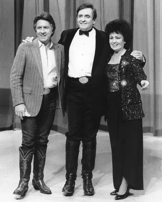 Framed Print : THE JOHNNY CASH CHRISTMAS SPECIAL, from left: brother Tommy Cash, Johnny Cash, sister Joanne Cash Yates, (aired December 8, 1976)