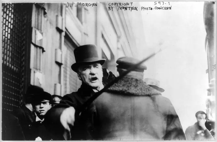 Framed Print : J.P. Morgan striking photographer with cane. 1910