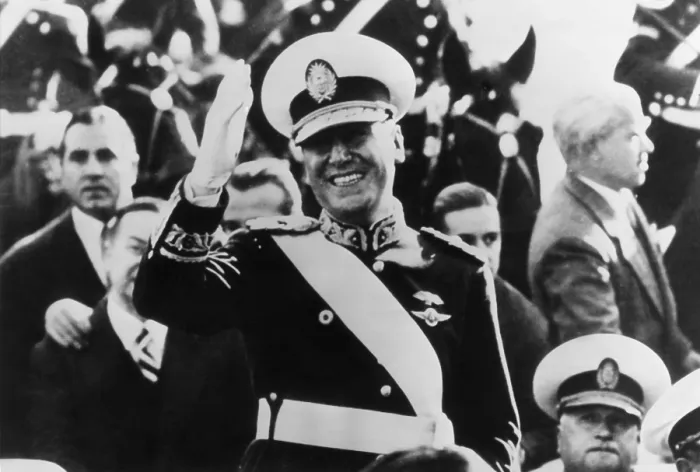 Framed Print : Juan Peron, newly elected President of Argentina waves to crowds from inaugural parade. Peron wears the uniform of a Brigadier General