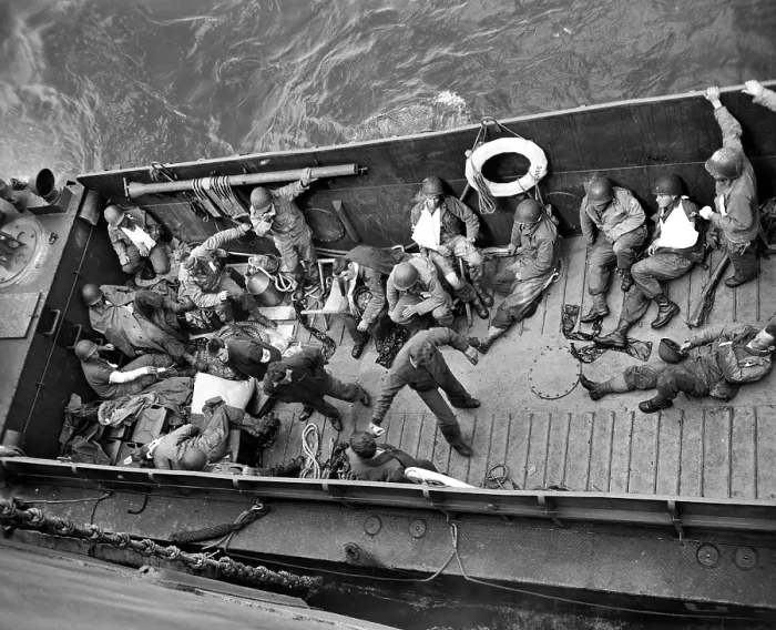 Framed Print : June 6, 1944: A Coast Guard landing barge ties up alongside a Coast Guard-manned invasion transport in the English Channel to transfer wounded American invaders to Framed Print : June 6, 1944: A Coast Guard landing barge ties up alongside a Coast Guard-manned invasion transport in the English Channel to transfer wounded American invaders to