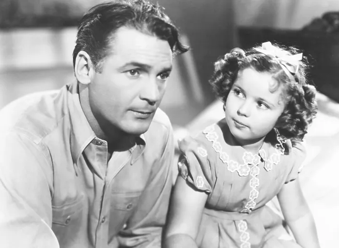 Framed Print : JUST AROUND THE CORNER, from left, Charles Farrell, Shirley Temple, 1938, TM & Copyright 20th Century Fox Film Corp. / courtesy Everett Collection