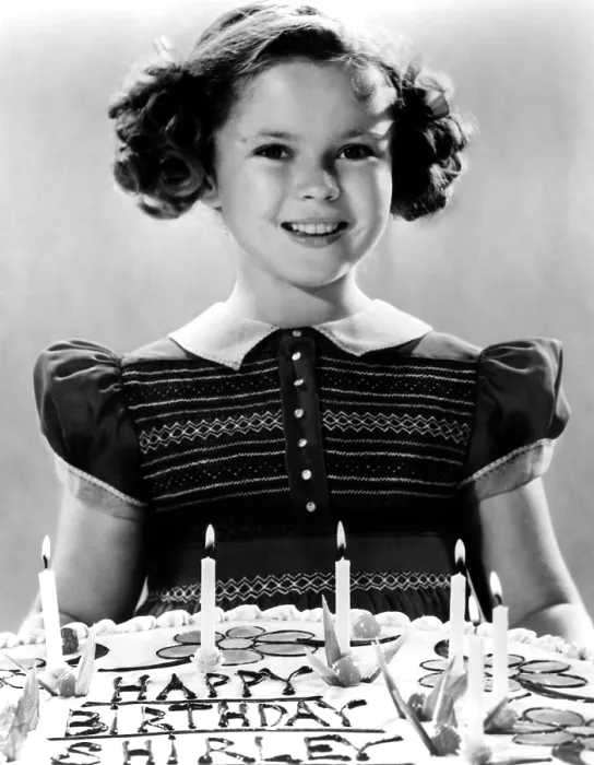 Framed Print : JUST AROUND THE CORNER, Shirley Temple with her birthday cake, on set, 1938. 20th Century-Fox Film Corporation, TM & Copyright / courtesy Everett Collection