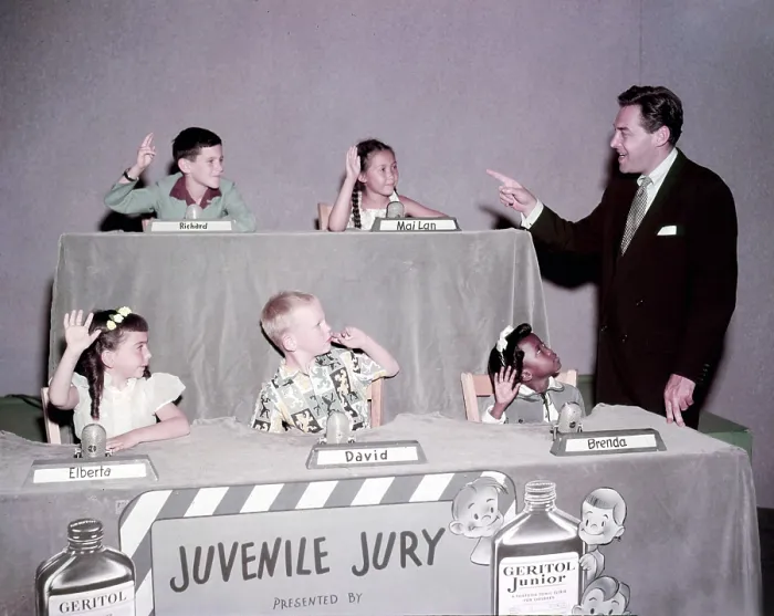 Framed Print : JUVENILE JURY, host Jack Barry (right) with child panelists, clockwise from top left: Richard, Mai-Lan, Brenda, David, and Elberta, (ca. early 1950s), 1947-1954