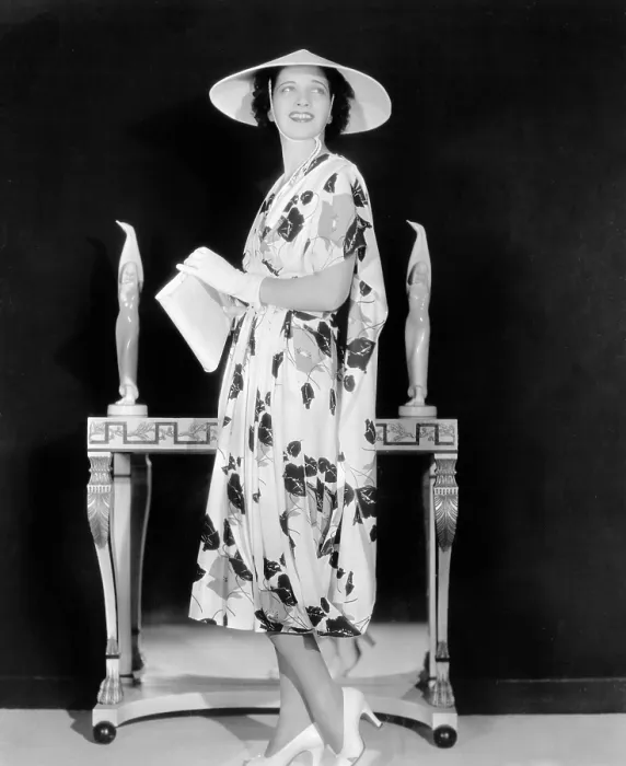 Framed Print : Kay Francis modeling floral-print crepe frock with white accessories from film ANOTHER DAWN, 1937 Framed Print : Kay Francis modeling floral-print crepe frock with white accessories from film ANOTHER DAWN, 1937
