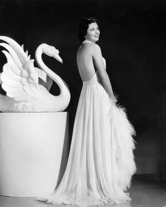 Framed Print : Kay Francis modeling white chiffon evening gown, 1937