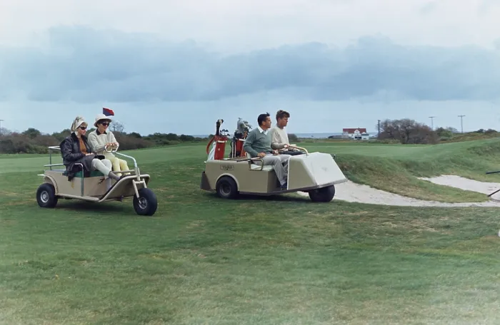 Framed Print : The Kennedys golf with the Ben Bradlees at the Newport Country Club. Antoinette Bradlee and Jacqueline Kennedy follow the golf cart of the President and Journalist Benn Bradlee Framed Print : The Kennedys golf with the Ben Bradlees at the Newport Country Club. Antoinette Bradlee and Jacqueline Kennedy follow the golf cart of the President and Journalist Benn Bradlee